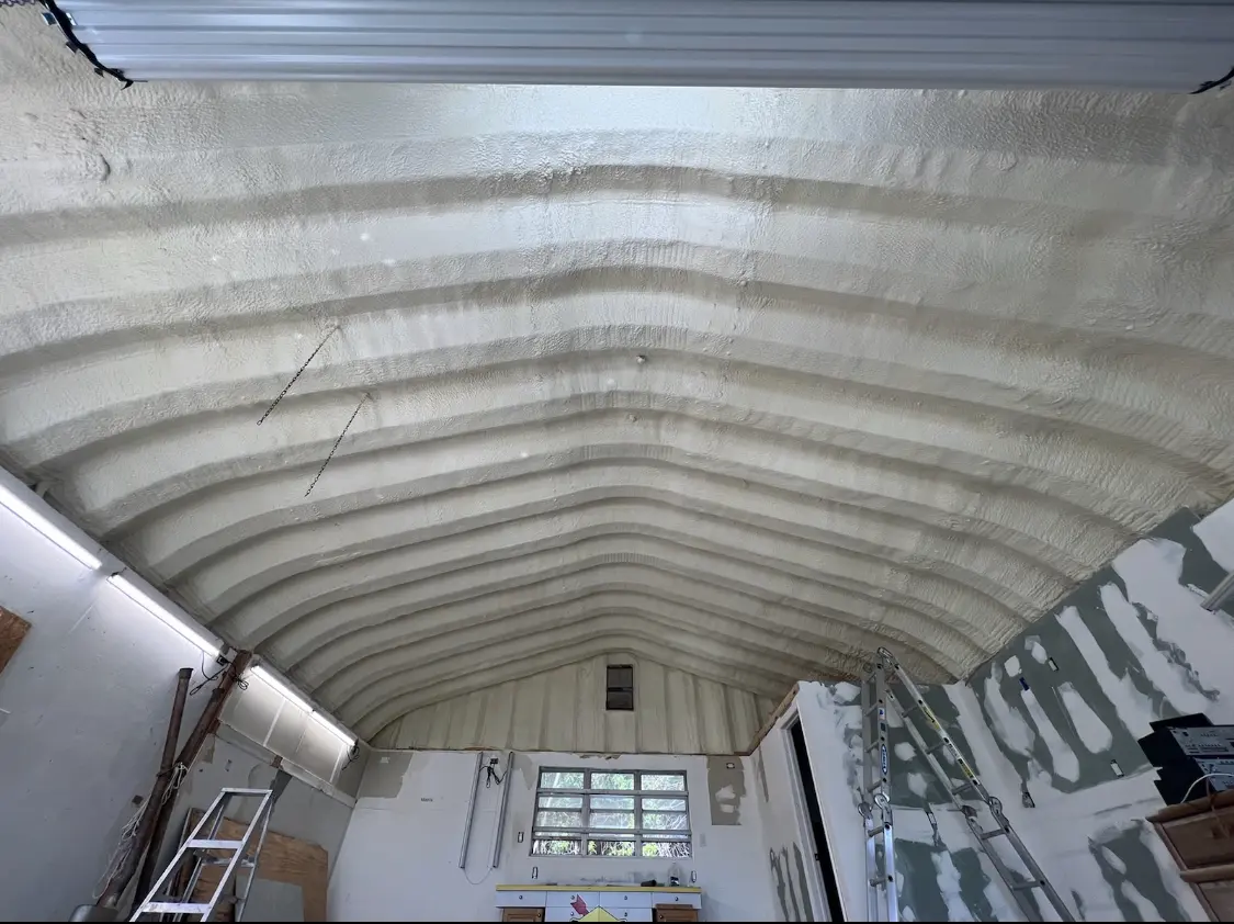 Spray polyurethane foam applied to the underside of a metal roof deck in Southern Pines